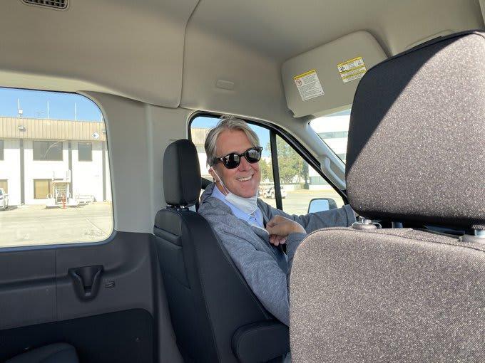 Actor Alan Ruck drives press van in US President Biden's motorcade