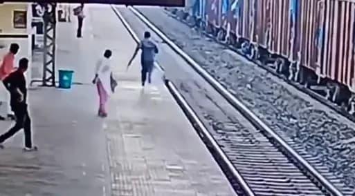 Video shows railway staff saving man from being hit by train | National ...