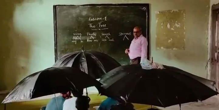 Video shows students holding umbrellas in class as roof leaks in MP