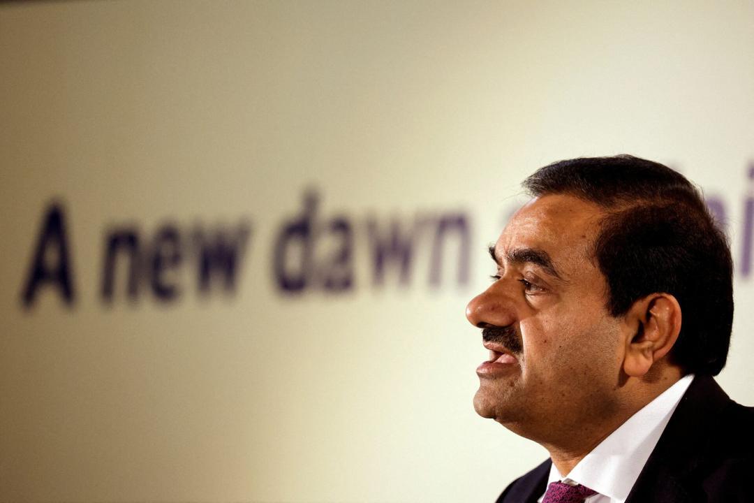 Adani Group stocks surge, then fall after bribery claims.